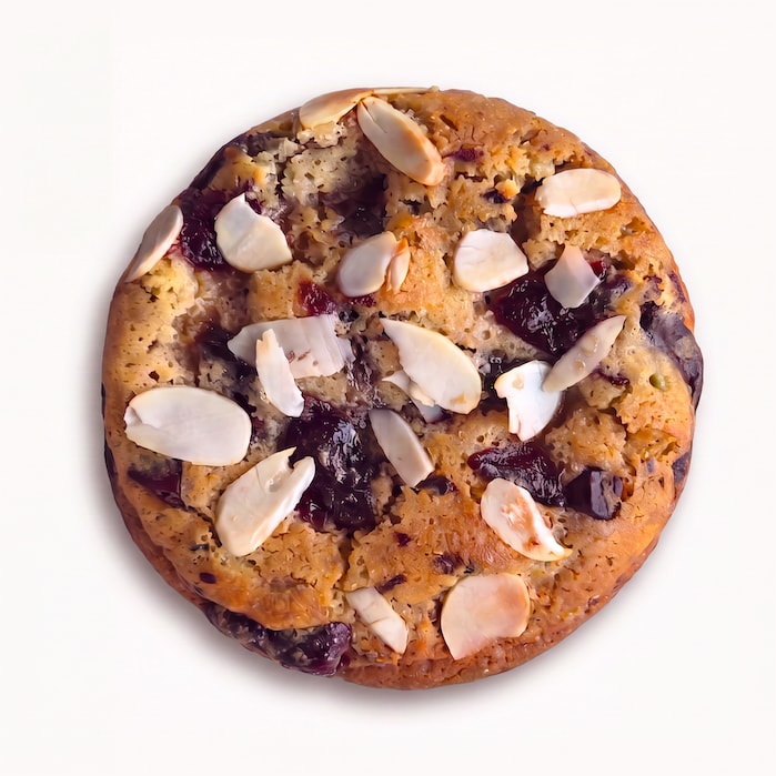 A handmade soft cookie with sour cherry, dark chocolate and almond flakes